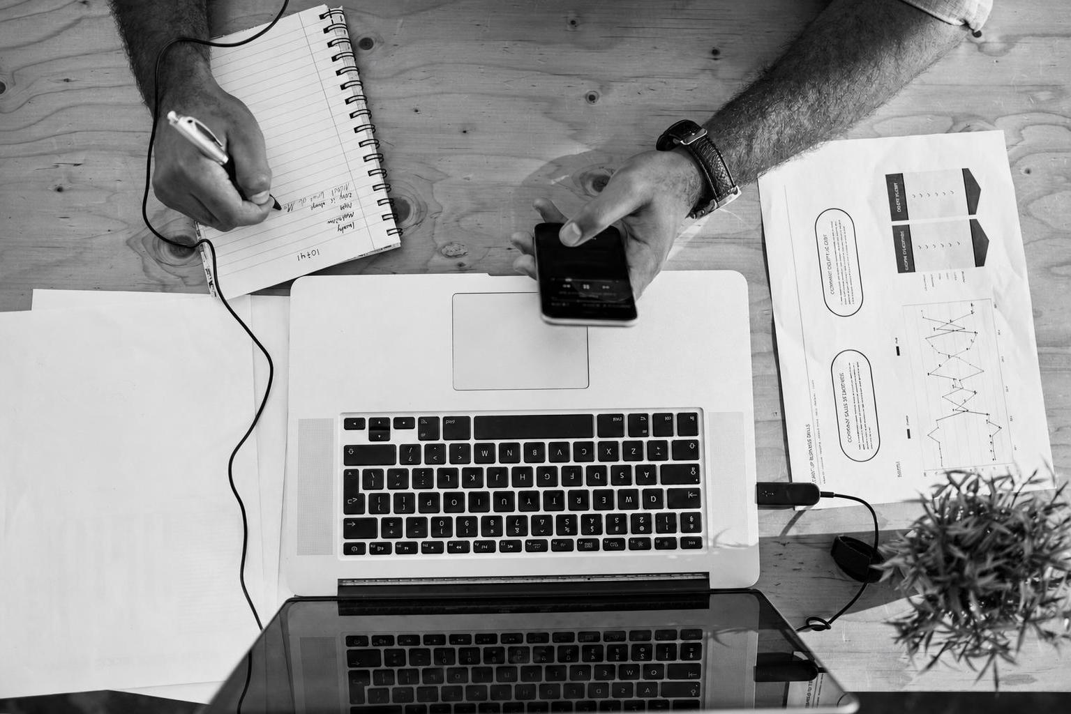 A startup founder reviewing MVP developer cost estimates and hiring model options