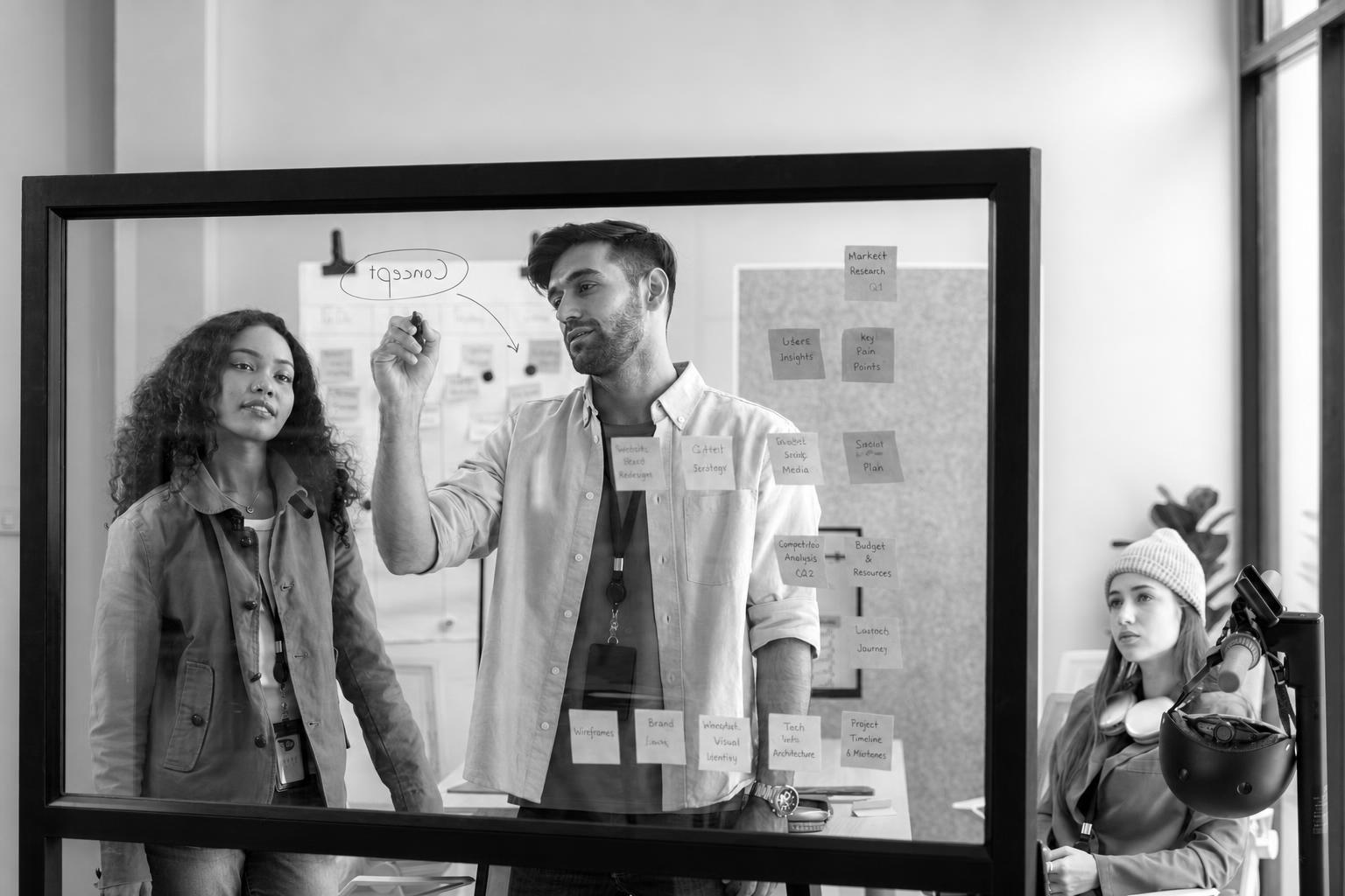 A product roadmap with nonessential app features crossed out before the MVP build starts