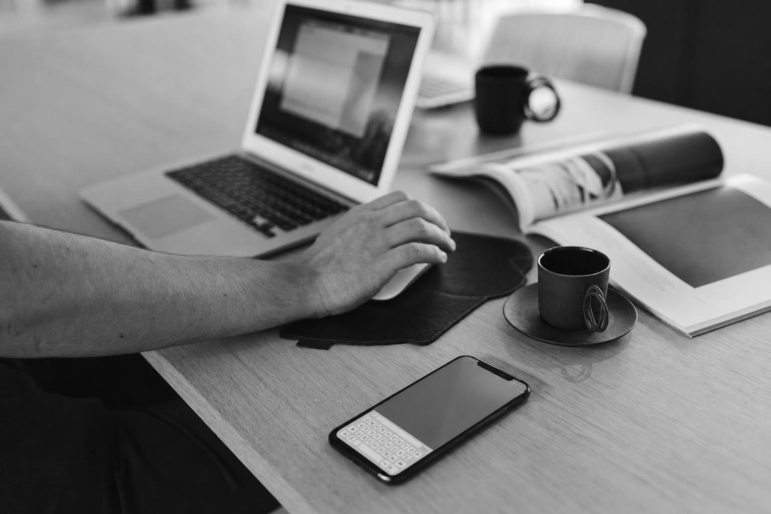 A laptop and phone showing the tradeoff between web app, PWA, and native mobile MVP choices