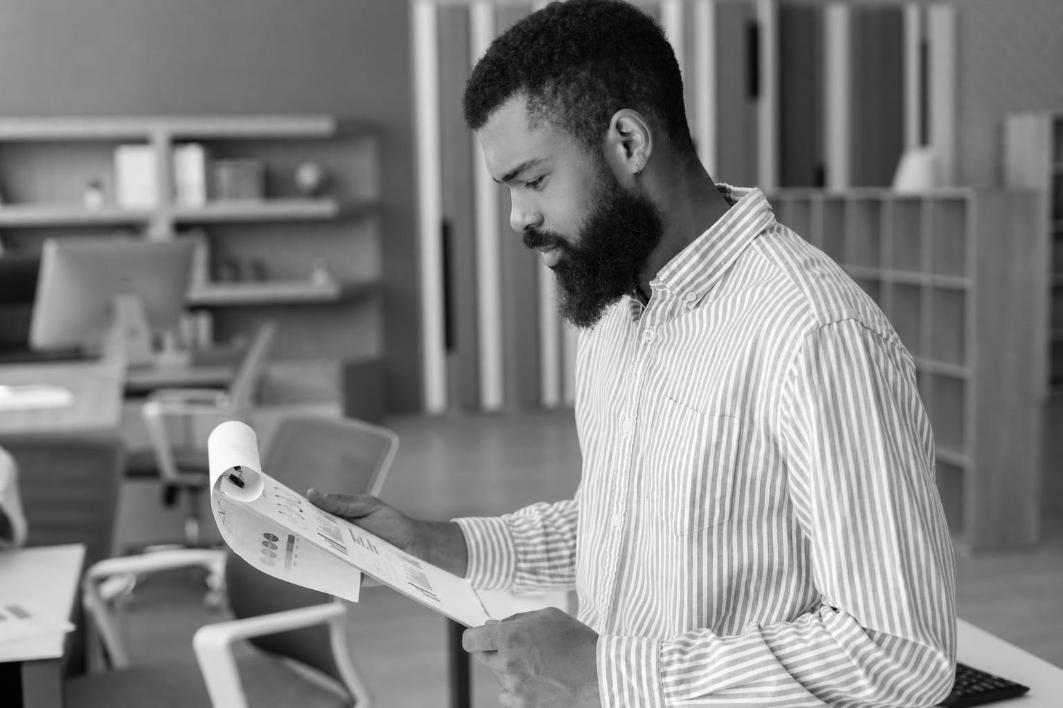 A founder reviewing project metrics and charts to evaluate build quality without reading code