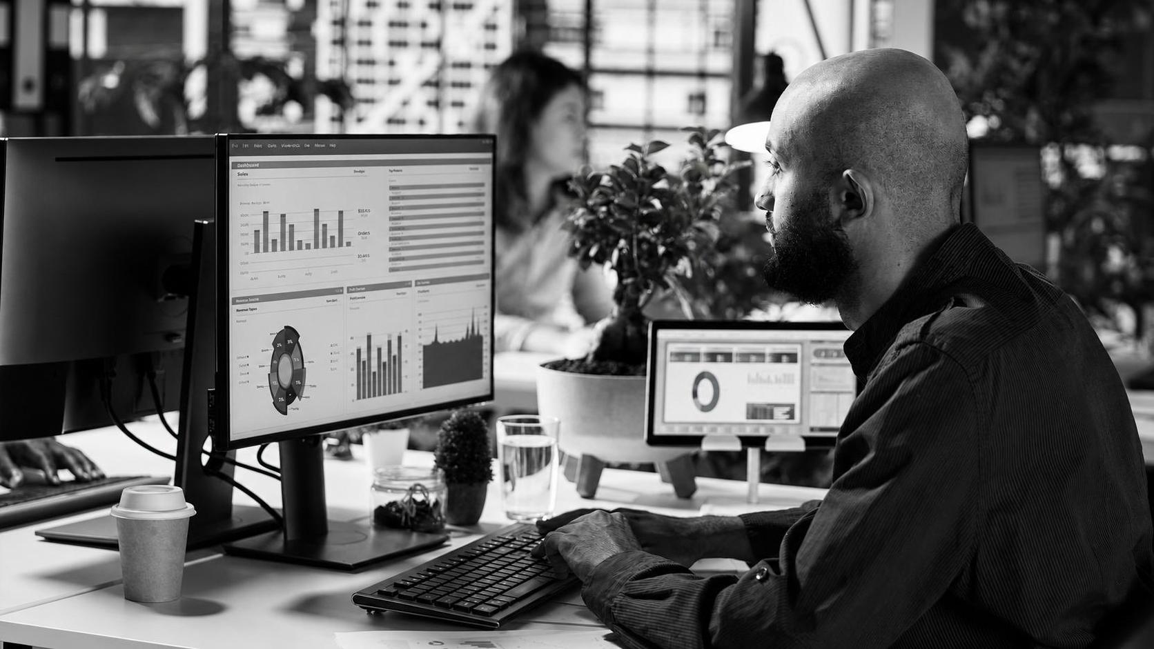 A founder reviewing post-launch activation rates and user feedback on an analytics dashboard