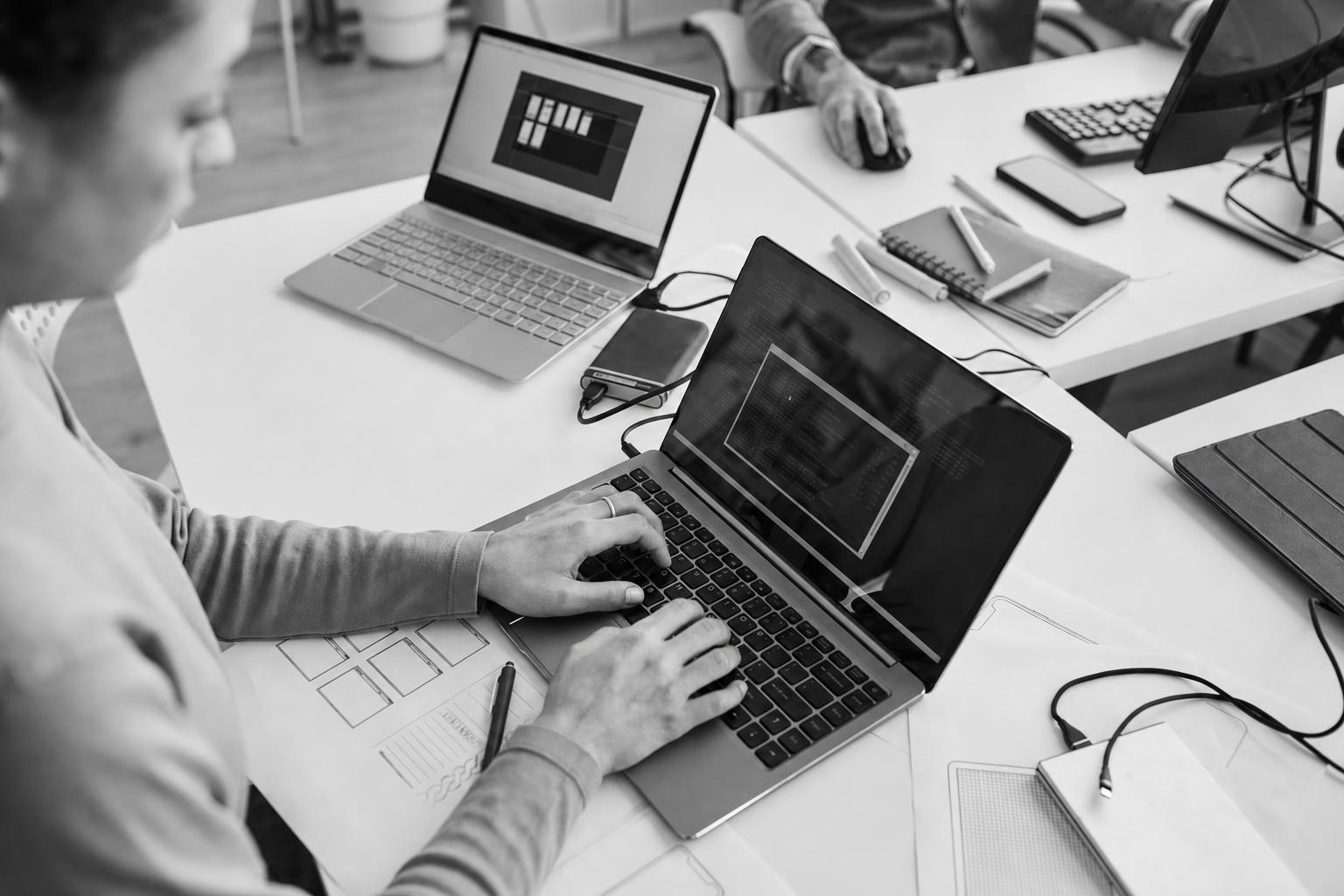 Developer reviewing a lean app build on a laptop