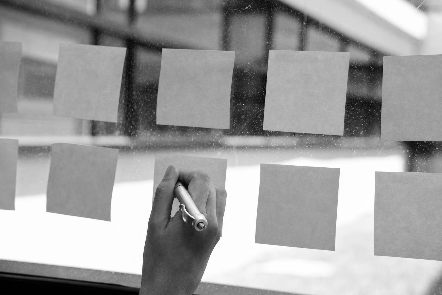 A founder organizing sticky notes into a post-launch backlog